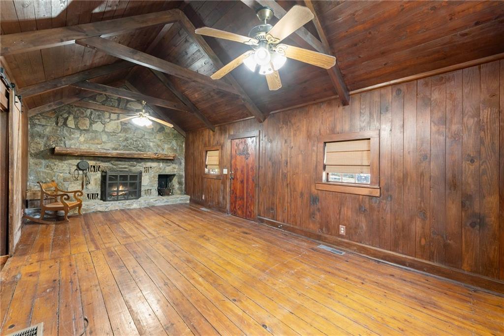 290 Chastain Road Sautee Nacoochee, GA 30571 - Photo 26 of 69 a view of livingroom with fireplace and chandelier fan