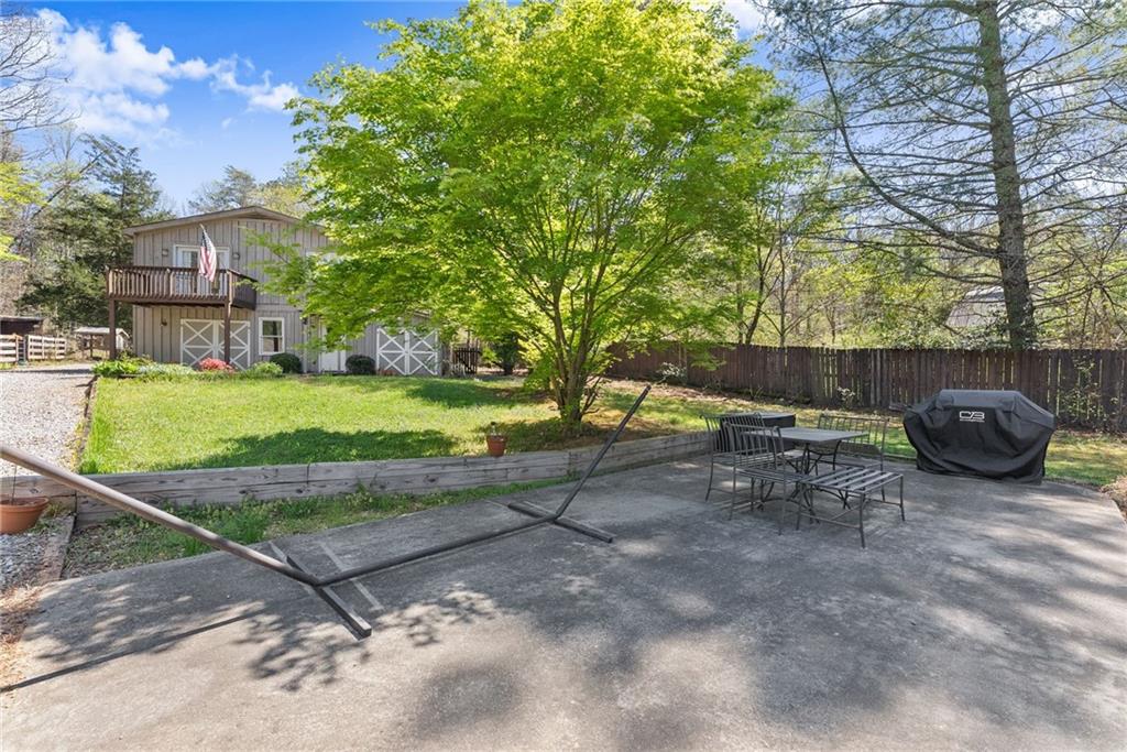 290 Chastain Road Sautee Nacoochee, GA 30571 - Photo 44 of 69 a view of backyard with table and chairs under an umbrella