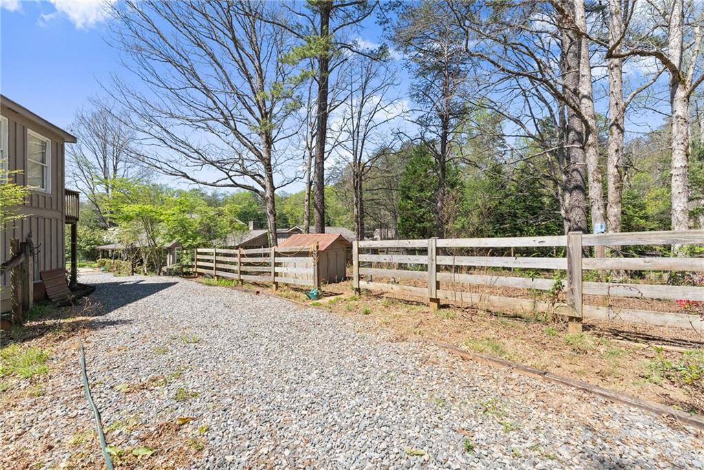 290 Chastain Road Sautee Nacoochee, GA 30571 - Photo 54 of 69 a view of backyard with wooden fence and large trees