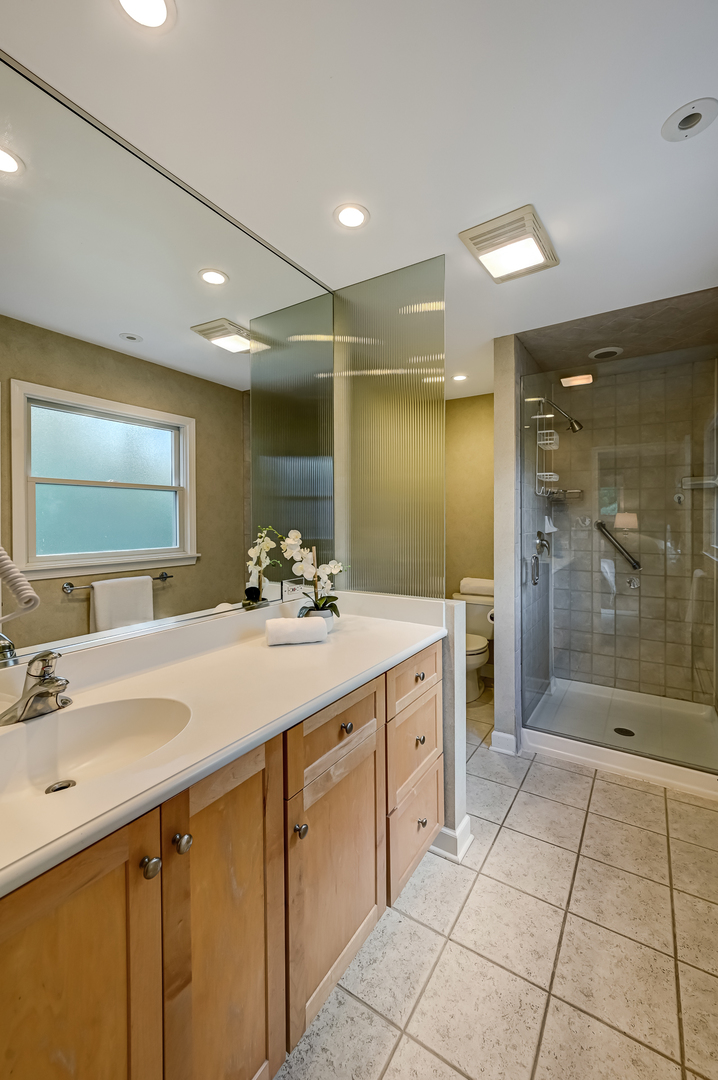 1200 Oak Hill Road Downers Grove, IL 60515 - Photo 14 of 24 a bathroom with a sink shower and a mirror