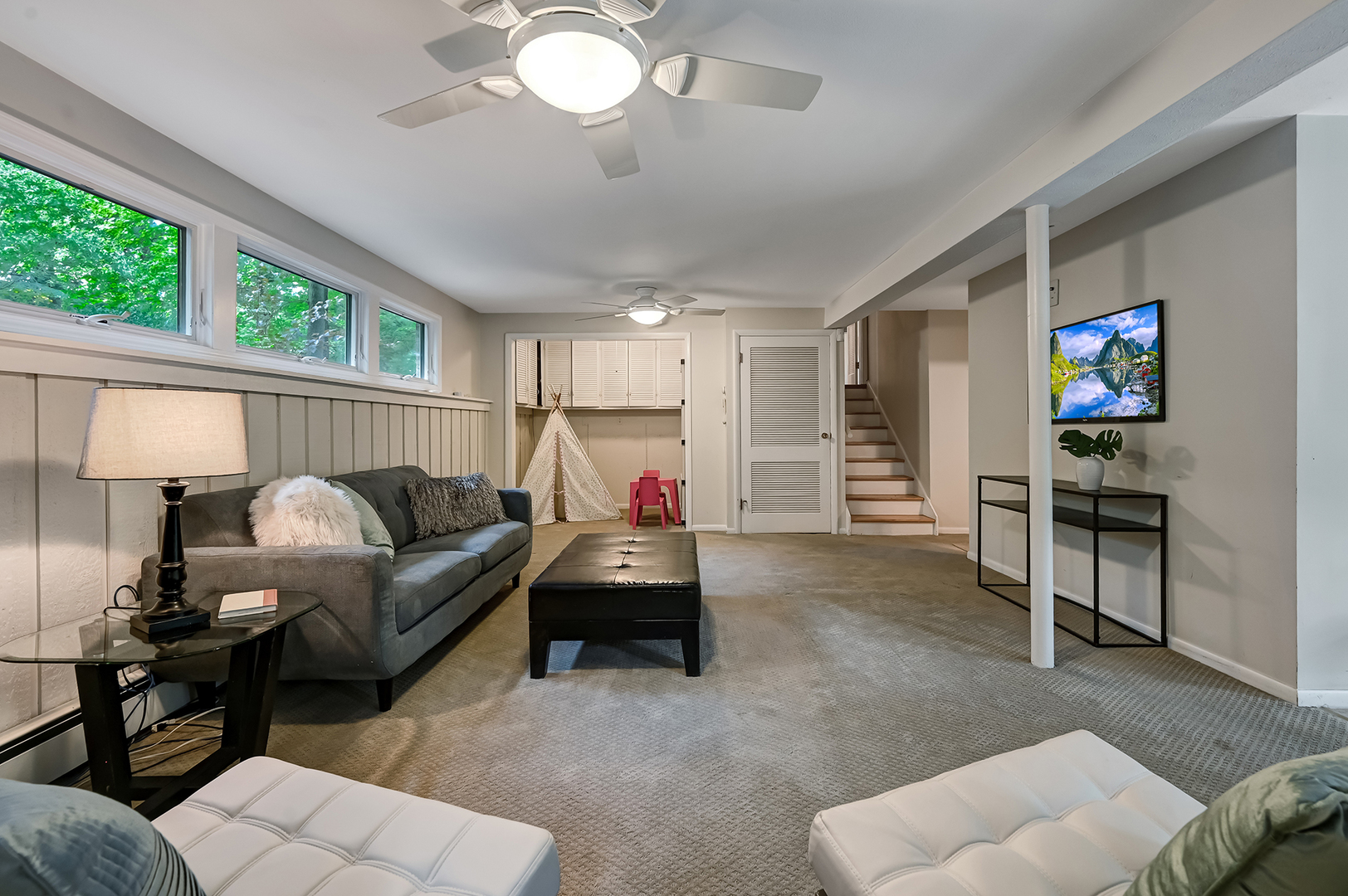 1200 Oak Hill Road Downers Grove, IL 60515 - Photo 20 of 24 a living room with furniture and a flat screen tv