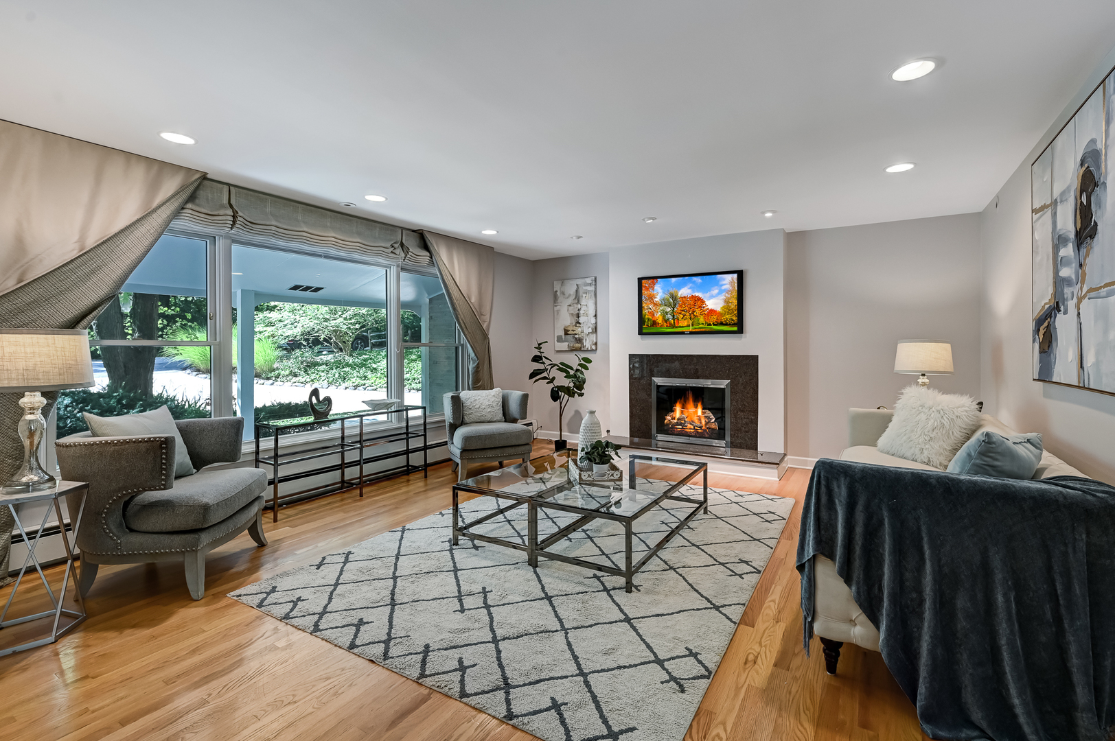 1200 Oak Hill Road Downers Grove, IL 60515 - Photo 2 of 24 a living room with furniture a fireplace and a flat screen tv