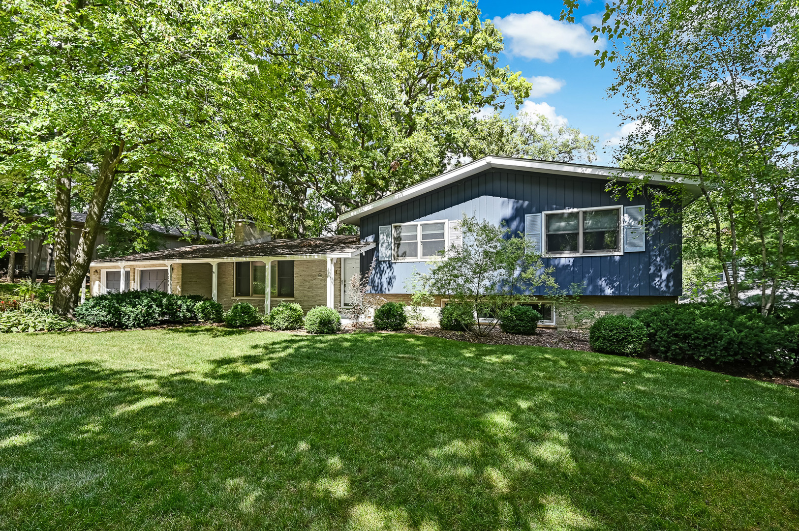 1200 Oak Hill Road Downers Grove, IL 60515 - Photo 24 of 24 a front view of a house with a yard and trees