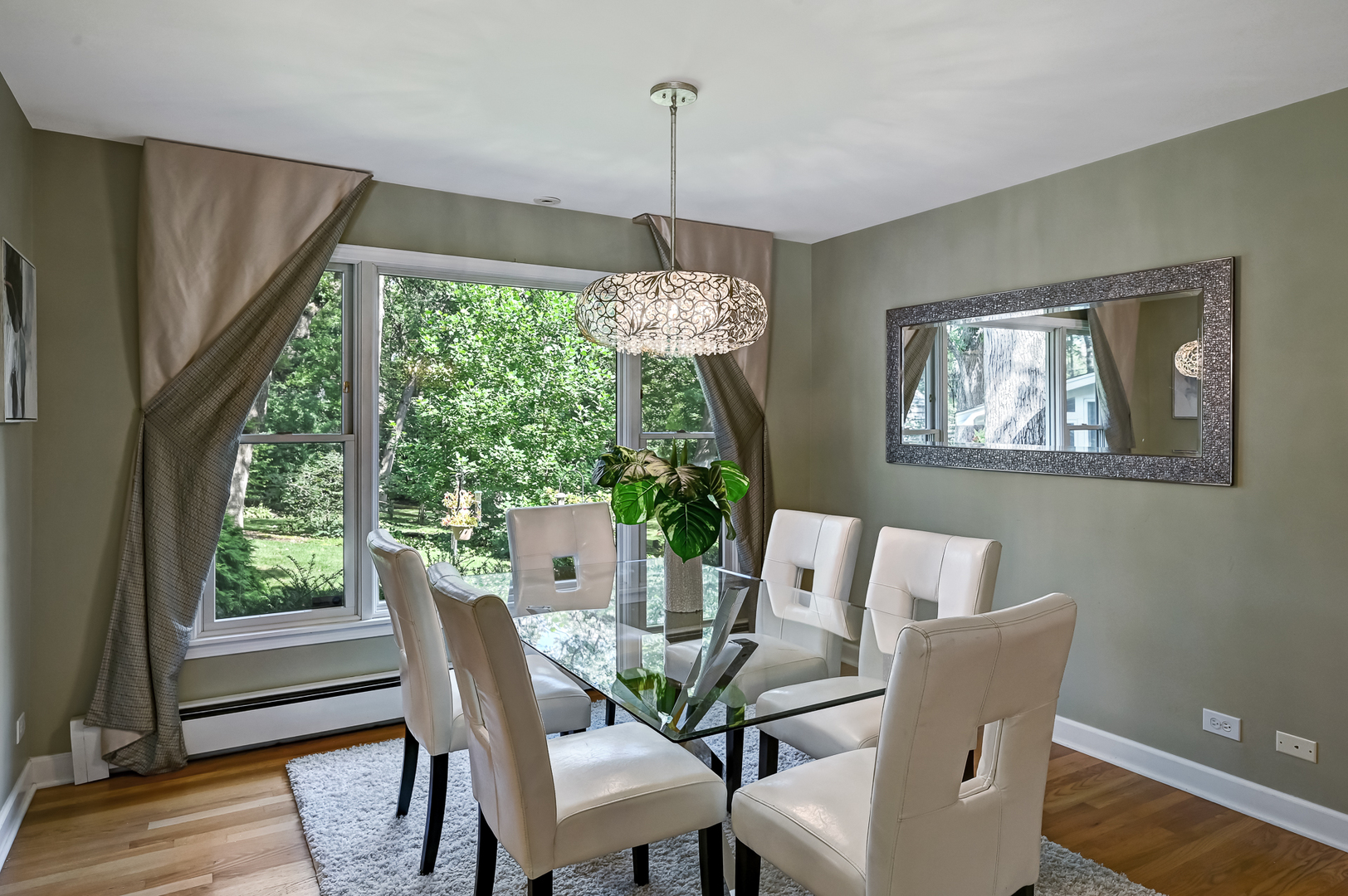 1200 Oak Hill Road Downers Grove, IL 60515 - Photo 5 of 24 a view of a dining room with furniture window and wooden floor