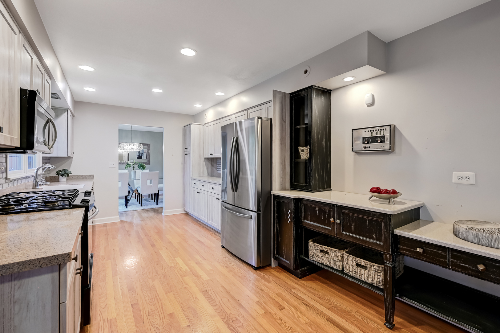 1200 Oak Hill Road Downers Grove, IL 60515 - Photo 8 of 24 a kitchen with stainless steel appliances a stove refrigerator and a refrigerator