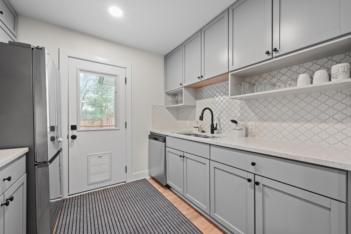 1307 Falcon Cove, Unit A Austin, TX 78745 - Photo 13 of 21 Laundry area featuring light wood finished floors and recessed lighting