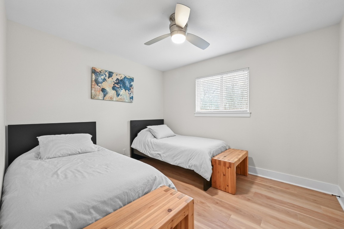 1307 Falcon Cove, Unit A Austin, TX 78745 - Photo 15 of 21 Bedroom featuring wood finished floors and a ceiling fan