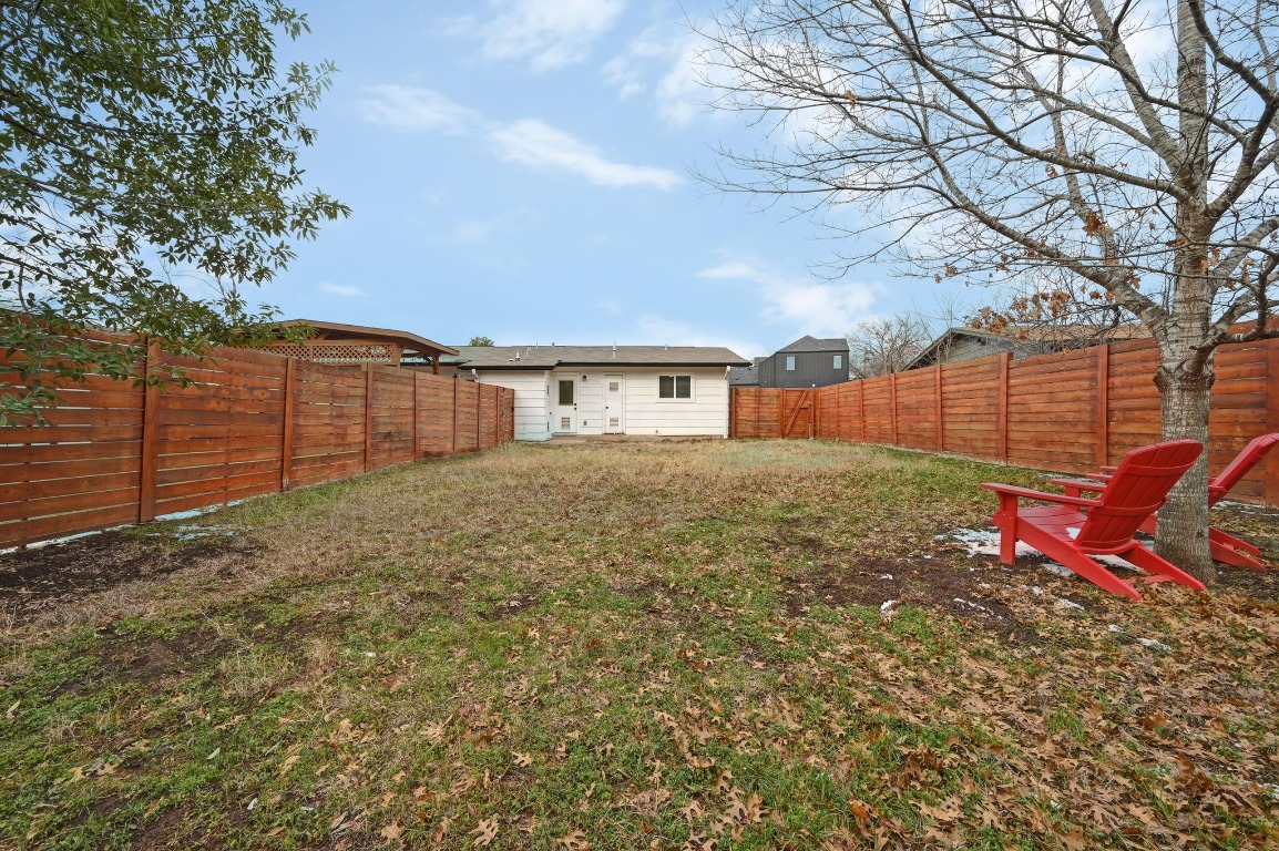 1307 Falcon Cove, Unit A Austin, TX 78745 - Photo 21 of 21 Back of property with a fenced backyard