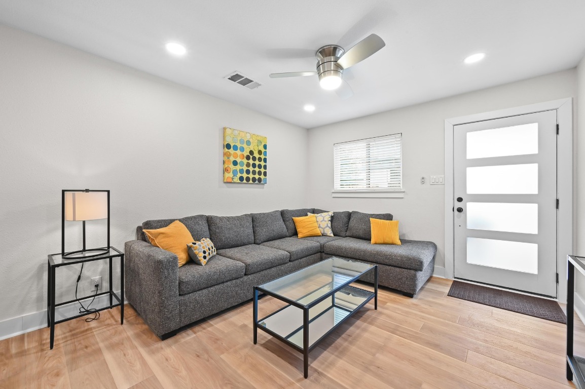 1307 Falcon Cove, Unit A Austin, TX 78745 - Photo 6 of 21 Living area with light wood-style floors, recessed lighting, and ceiling fan