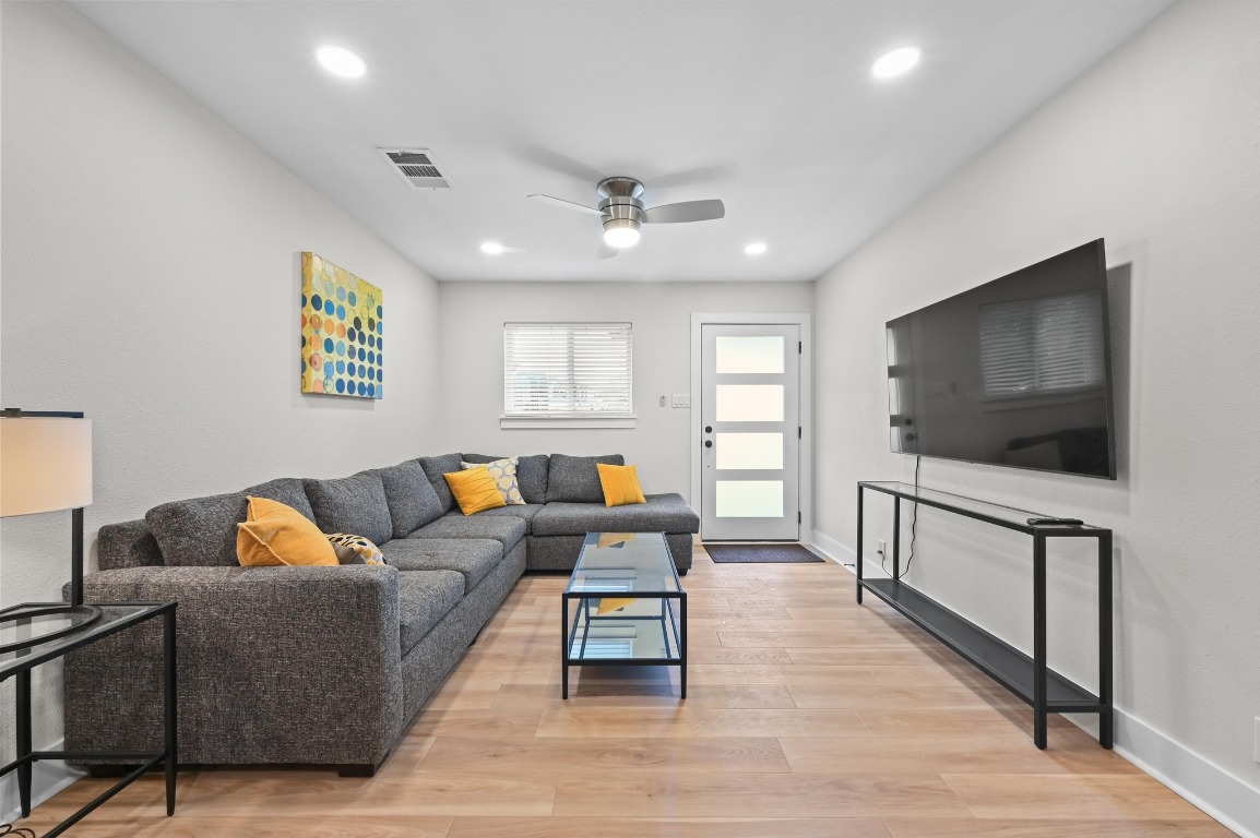 1307 Falcon Cove, Unit A Austin, TX 78745 - Photo 7 of 21 Living room featuring light wood finished floors, recessed lighting, and a ceiling fan