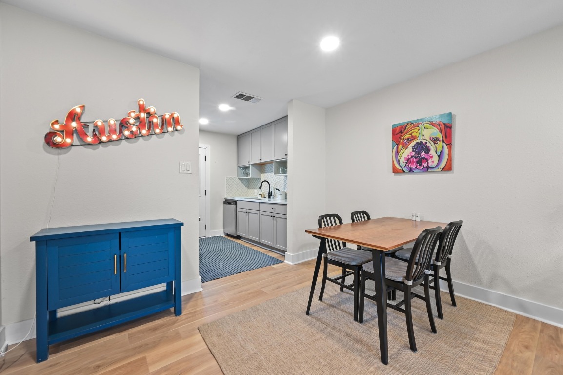 1307 Falcon Cove, Unit A Austin, TX 78745 - Photo 9 of 21 Dining area with light wood finished floors and recessed lighting