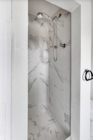 2643 Ridge Road Lansing, IL 60438 - Photo 20 of 30 a bathroom with a glass shower door