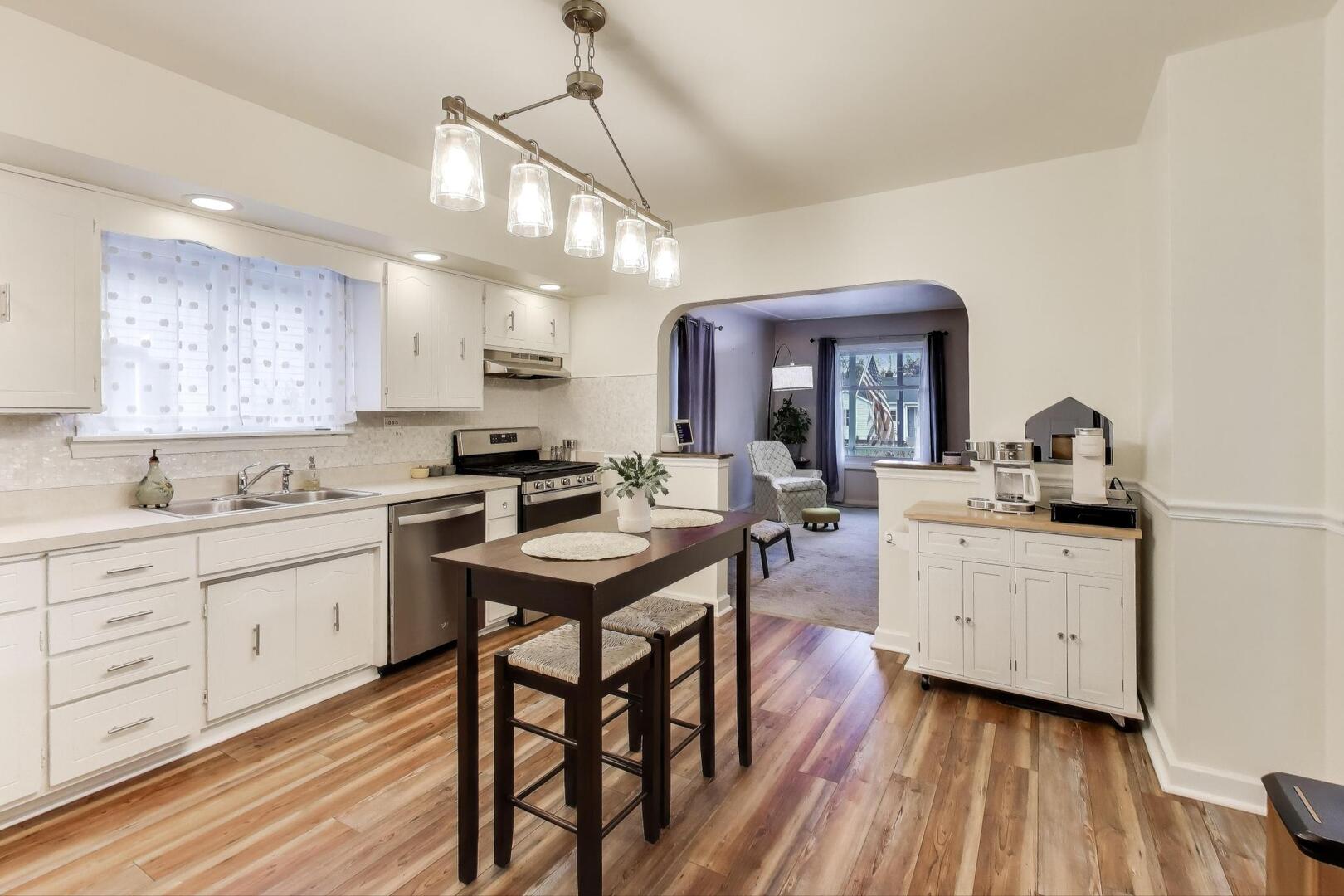 2643 Ridge Road Lansing, IL 60438 - Photo 9 of 30 a kitchen with sink cabinets and wooden floor