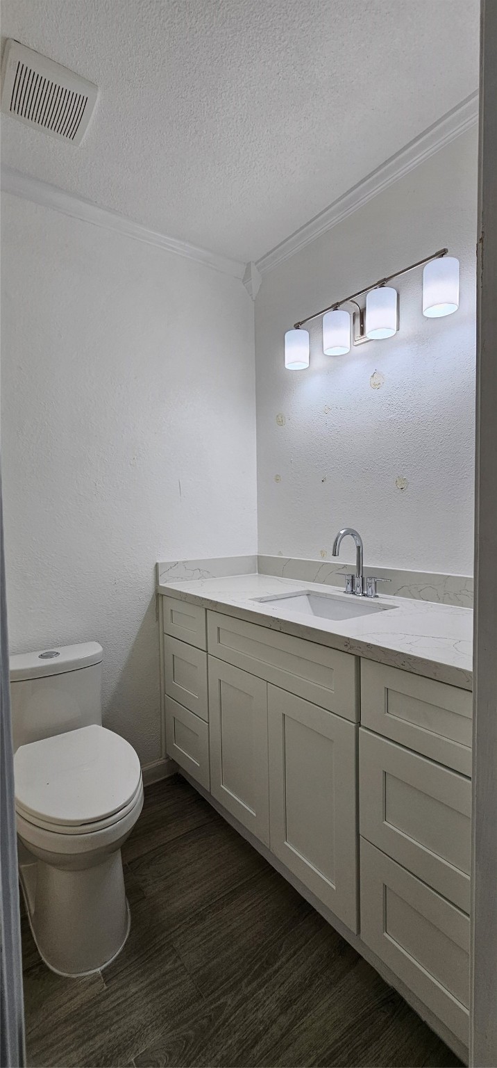 811 Knights Bridge Lane, Unit A Webster, TX 77058 - Photo 11 of 11 a bathroom with a toilet sink and mirror