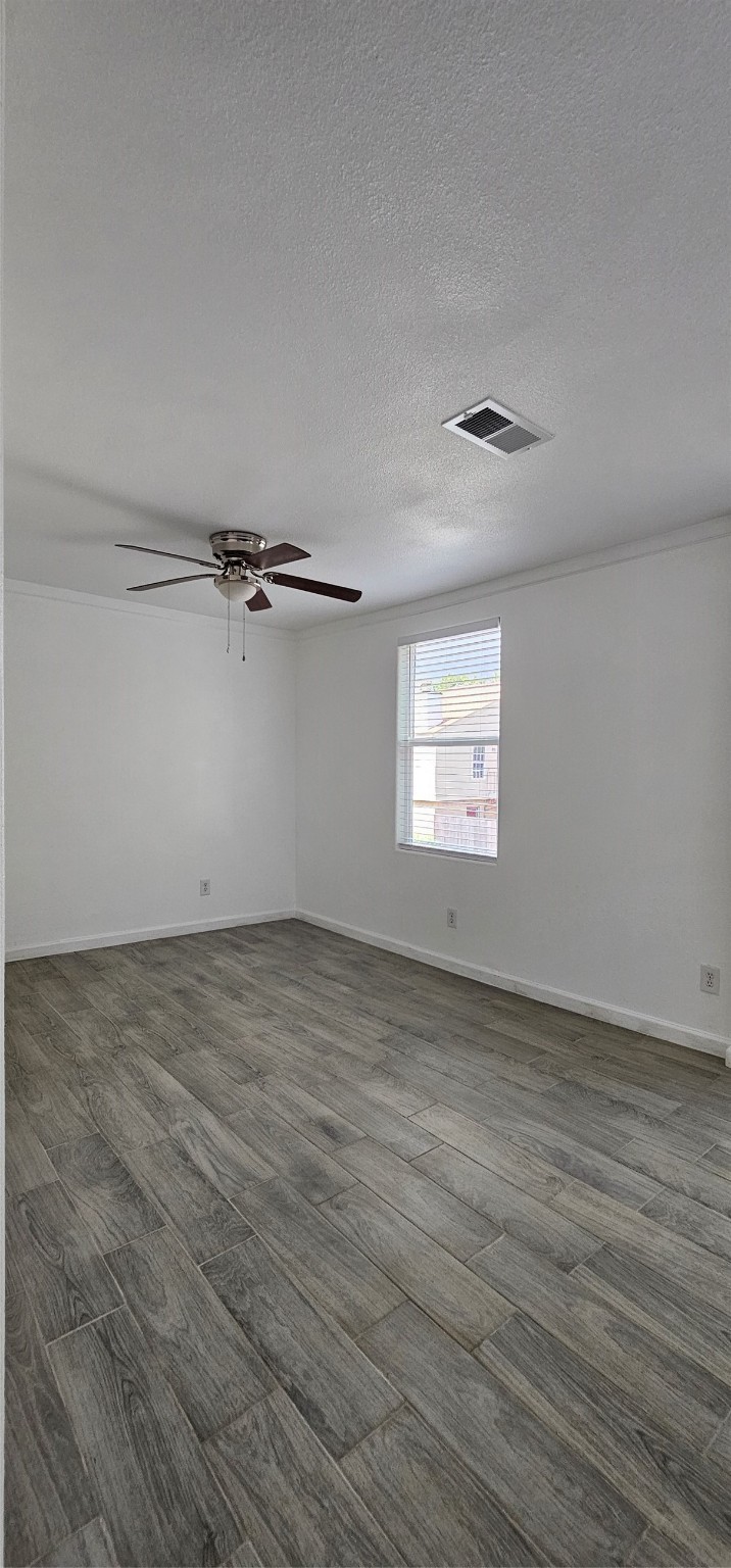 811 Knights Bridge Lane, Unit A Webster, TX 77058 - Photo 3 of 11 wooden floor in an empty room