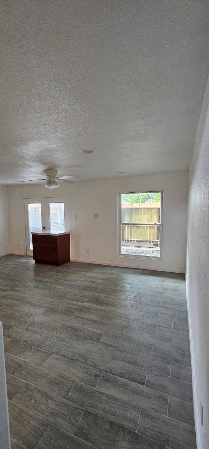 811 Knights Bridge Lane, Unit A Webster, TX 77058 - Photo 8 of 11 a view of empty room with wooden floor