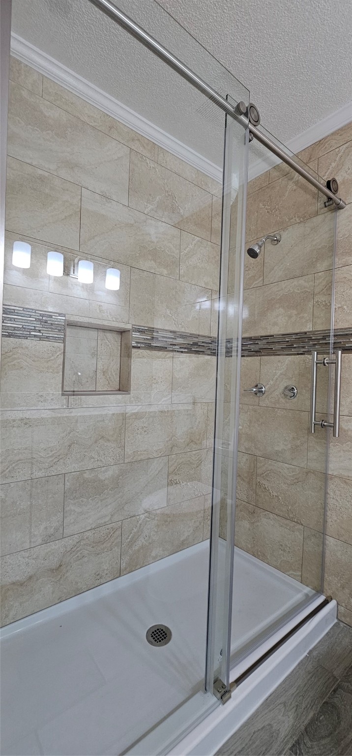 811 Knights Bridge Lane, Unit A Webster, TX 77058 - Photo 10 of 11 a bathroom with a shower