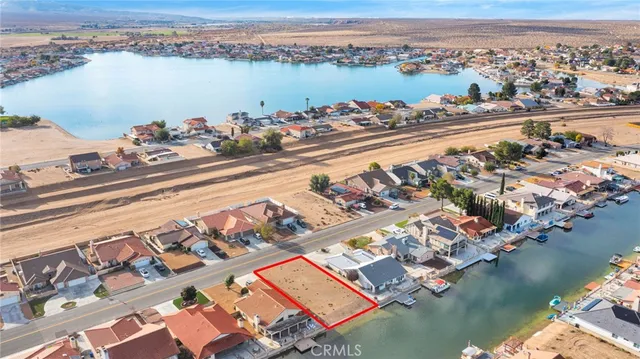 an aerial view of a house with a lake view