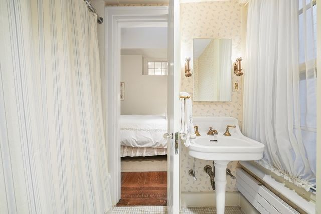 a bathroom with a sink and a mirror