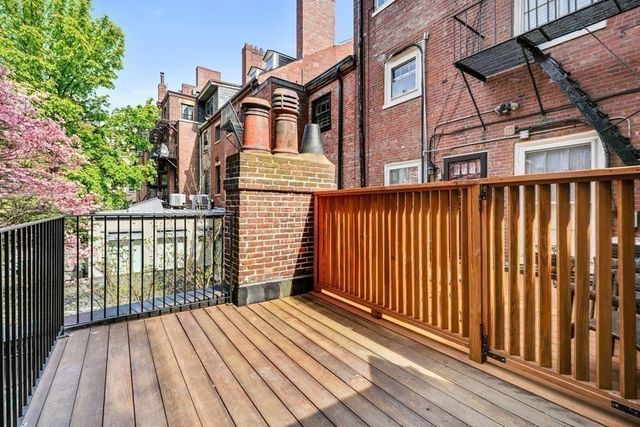 a view of a brick building from a balcony