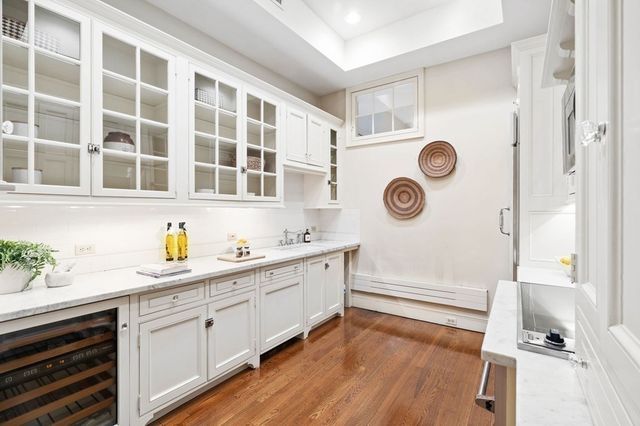 a kitchen with a refrigerator and a stove