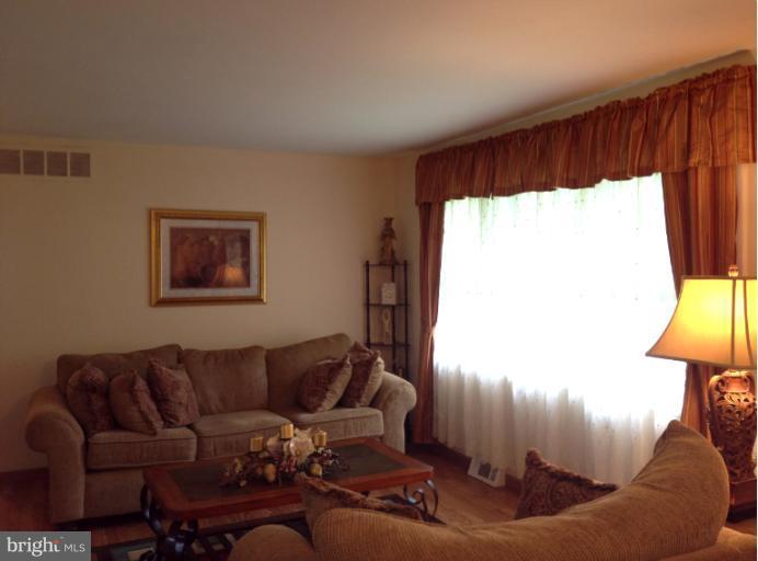 306 Bryanstone Road Reisterstown, MD 21136 - Photo 2 of 21 a living room with furniture and a window
