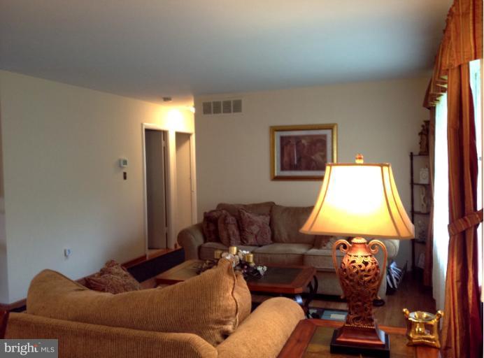 306 Bryanstone Road Reisterstown, MD 21136 - Photo 11 of 21 a living room with furniture and a flat screen tv