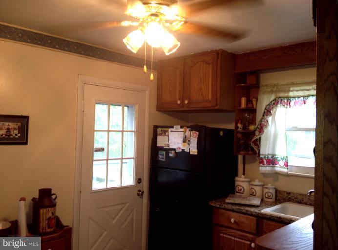 306 Bryanstone Road Reisterstown, MD 21136 - Photo 12 of 21 a view of a workspace with furniture and a window