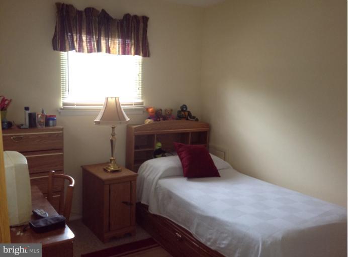 306 Bryanstone Road Reisterstown, MD 21136 - Photo 18 of 21 a bedroom with a bed and a window