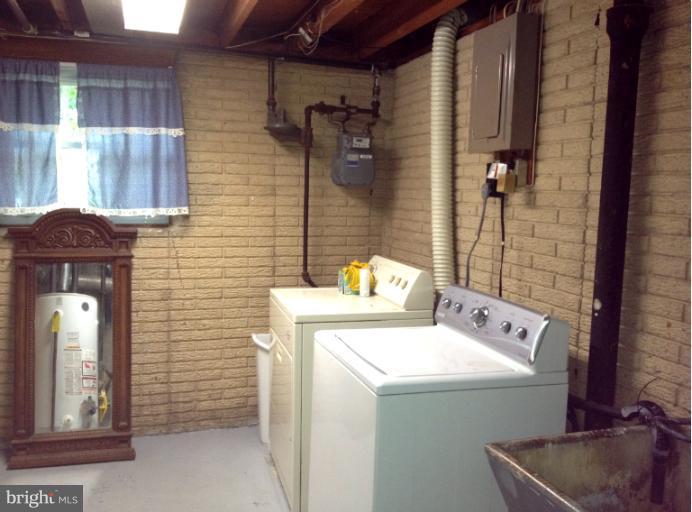 306 Bryanstone Road Reisterstown, MD 21136 - Photo 3 of 21 a utility room with dryer and washer