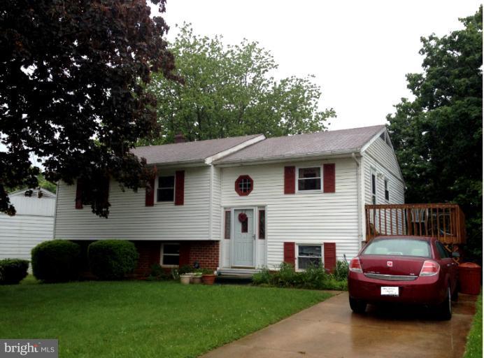 306 Bryanstone Road Reisterstown, MD 21136 - Photo 21 of 21 a front view of a house with a garden