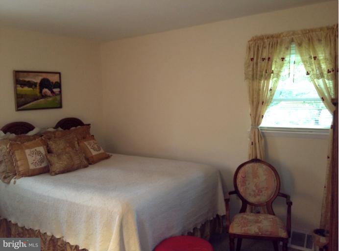 306 Bryanstone Road Reisterstown, MD 21136 - Photo 7 of 21 a bedroom with a bed and a window
