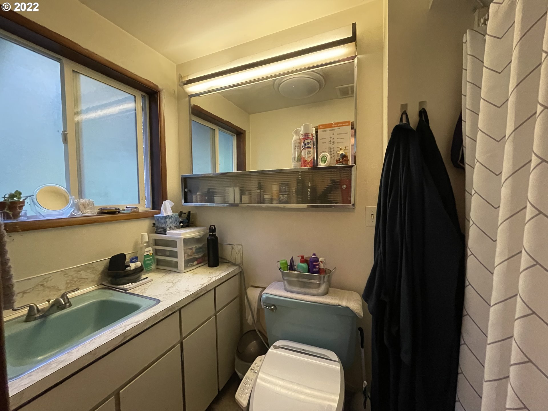 73860 Debast Road Rainier, OR 97048 - Photo 12 of 30 a bathroom with a sink and a mirror