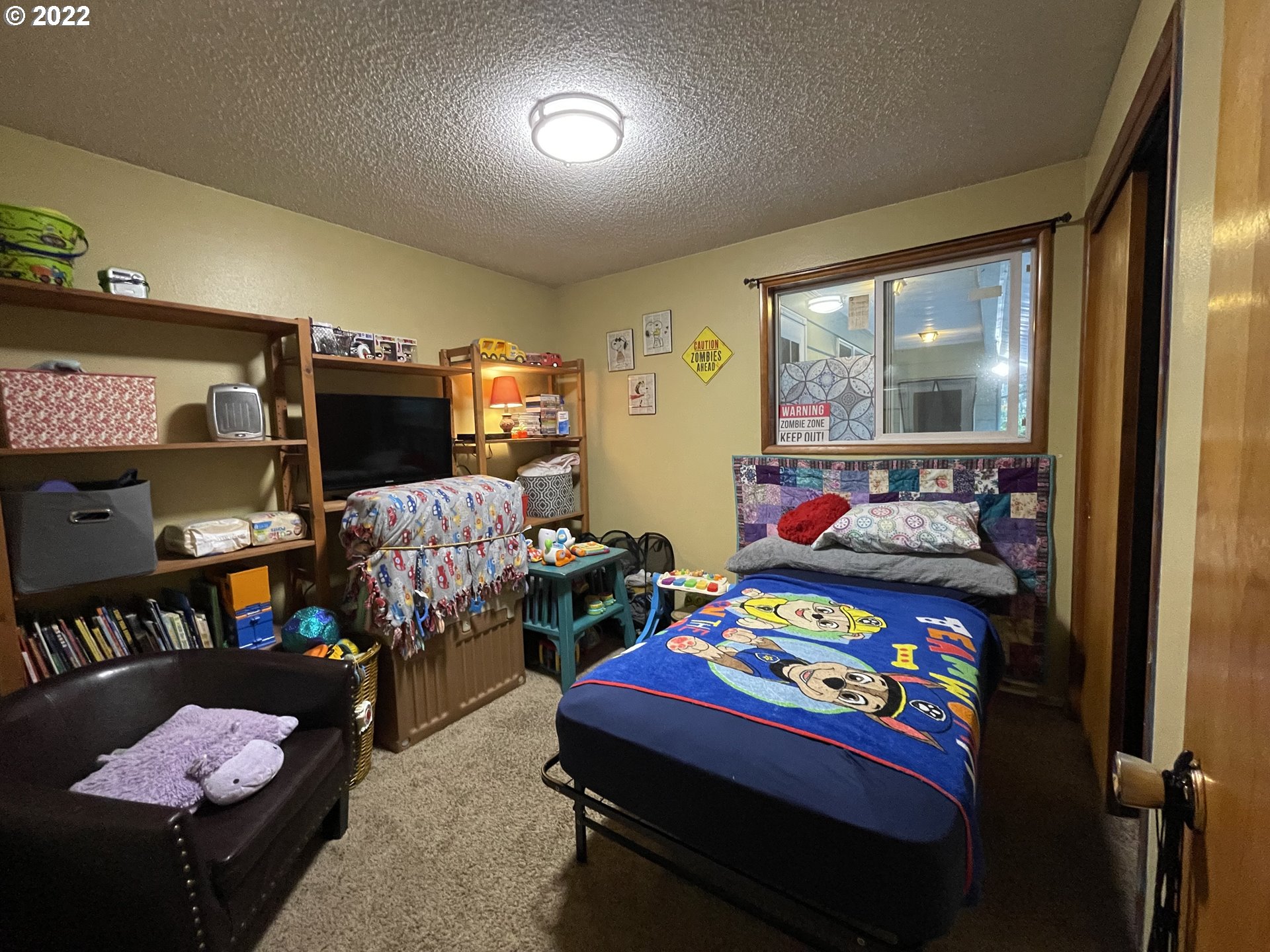 73860 Debast Road Rainier, OR 97048 - Photo 14 of 30 a bedroom with a bed and a dresser