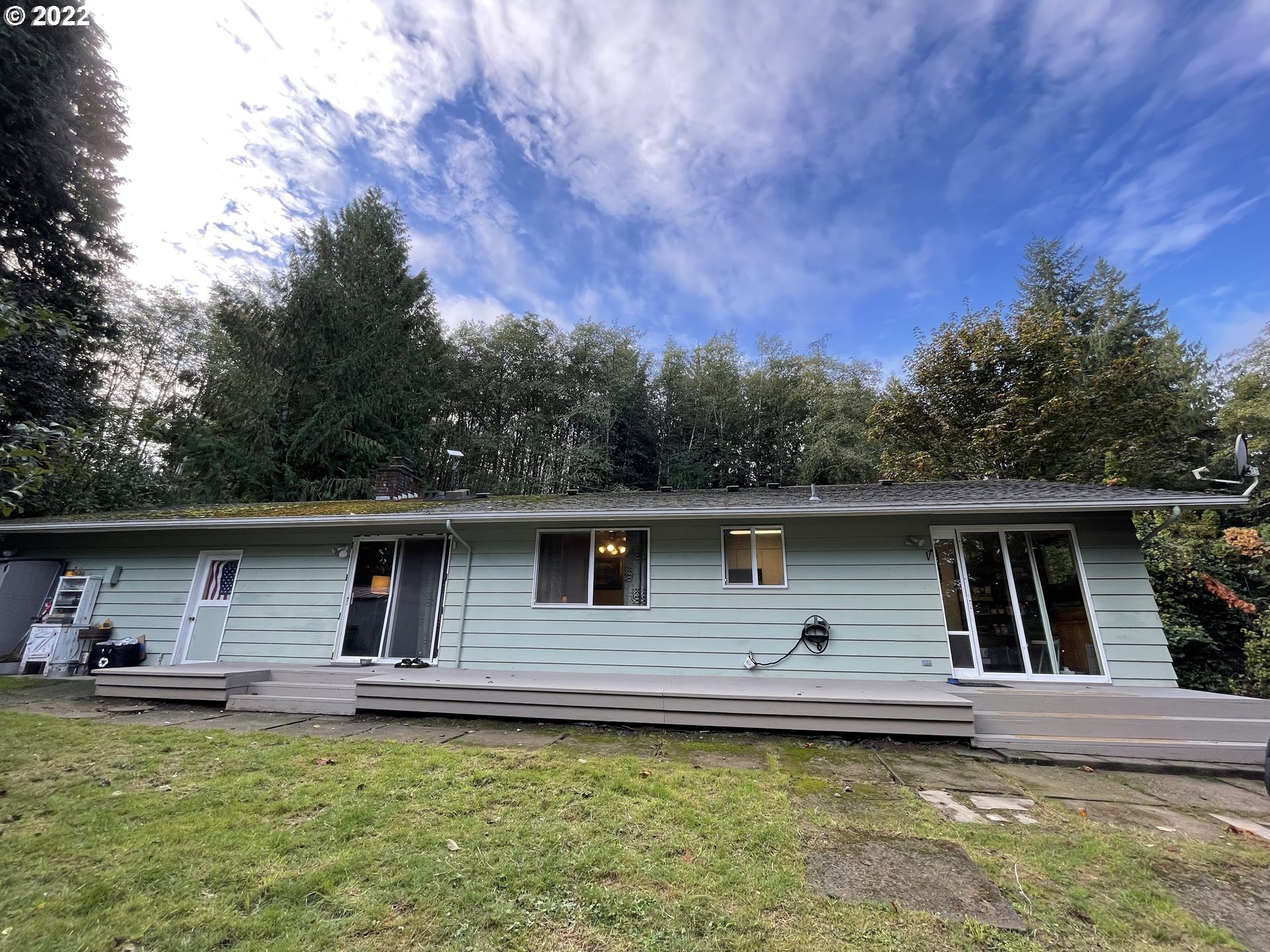 73860 Debast Road Rainier, OR 97048 - Photo 21 of 30 a front view of house with yard and trees in the background