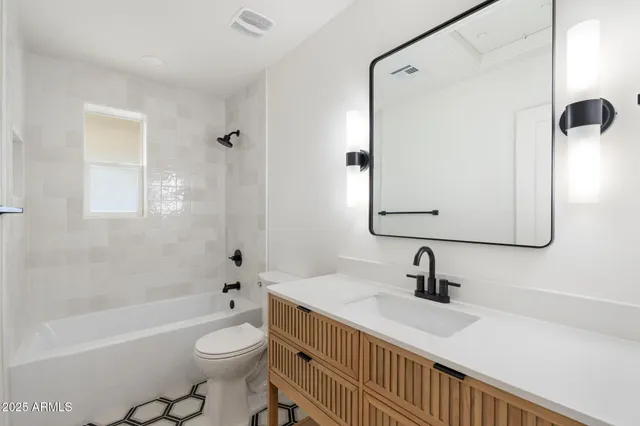 a view of a bathroom with a shower curtain