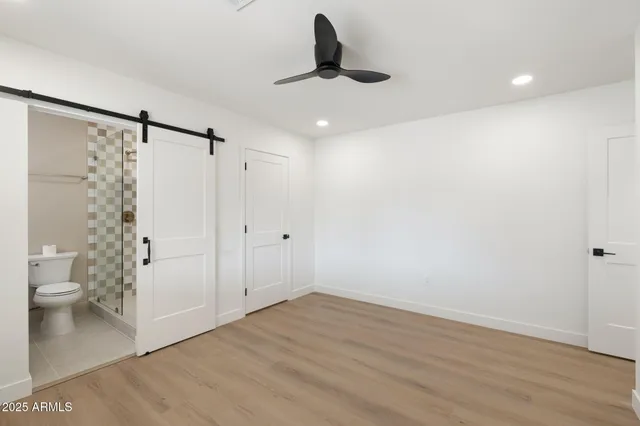 a bathroom with a toilet and a shower curtain