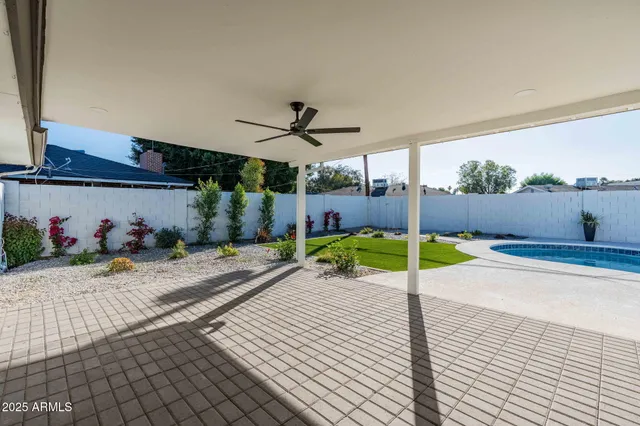 a view of a swimming pool with a lounge chairs