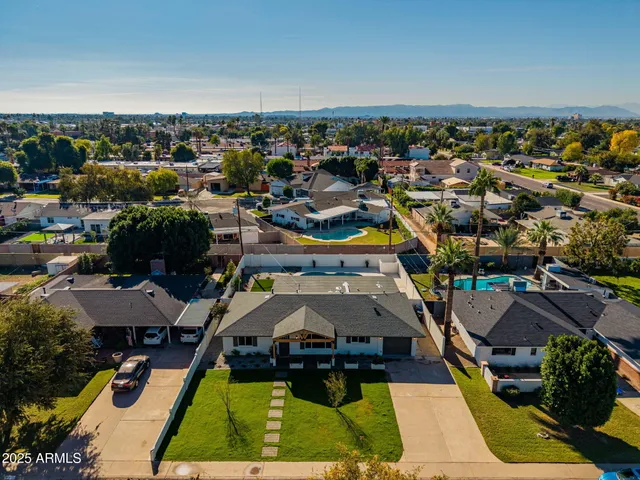 an aerial view of residential houses with outdoor space
