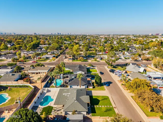 an aerial view of residential houses with outdoor space