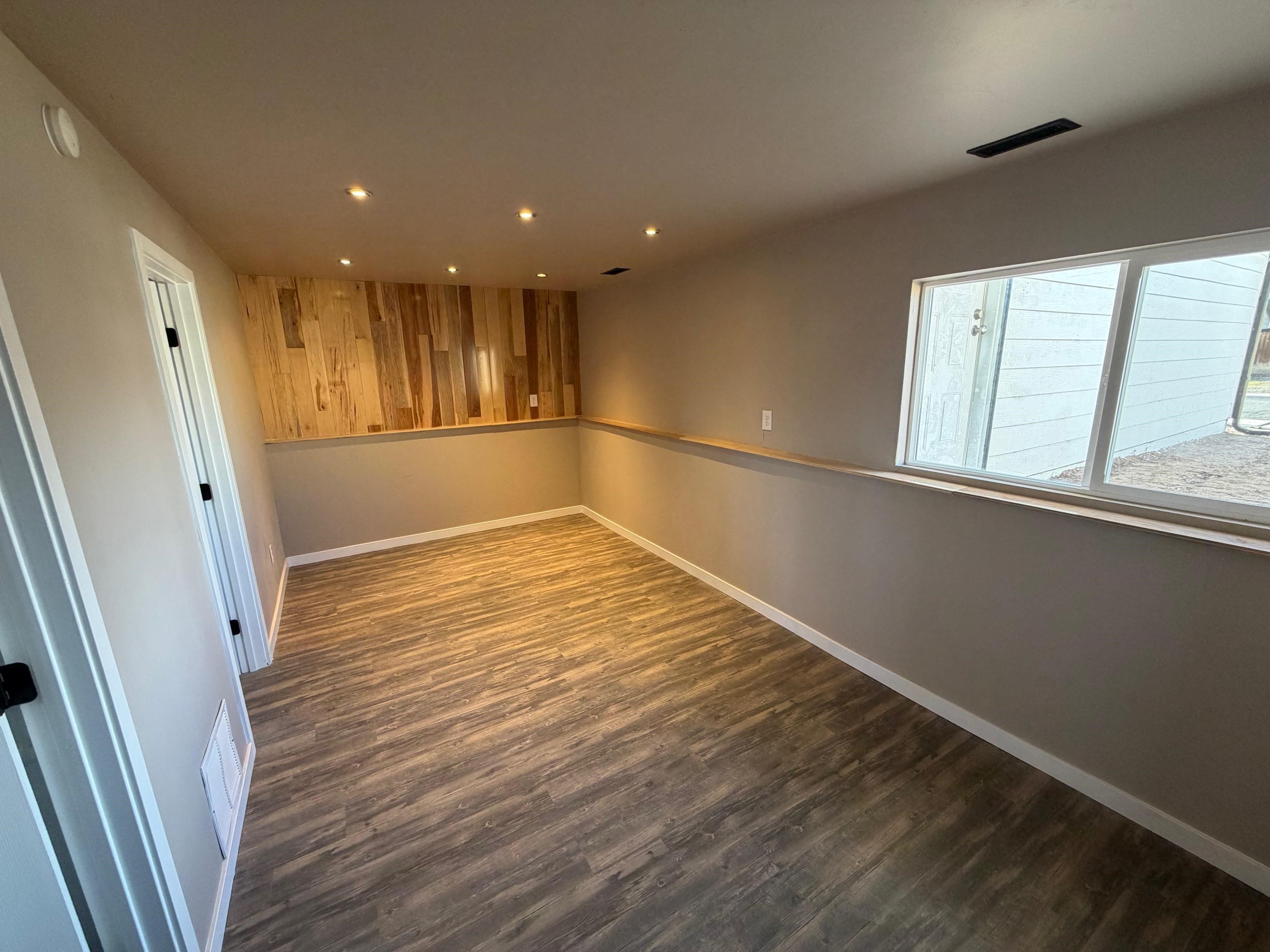 558 1/2 31 3/4 Road Grand Junction, CO 81504 - Photo 15 of 25 a view of an empty room with wooden floor and a window