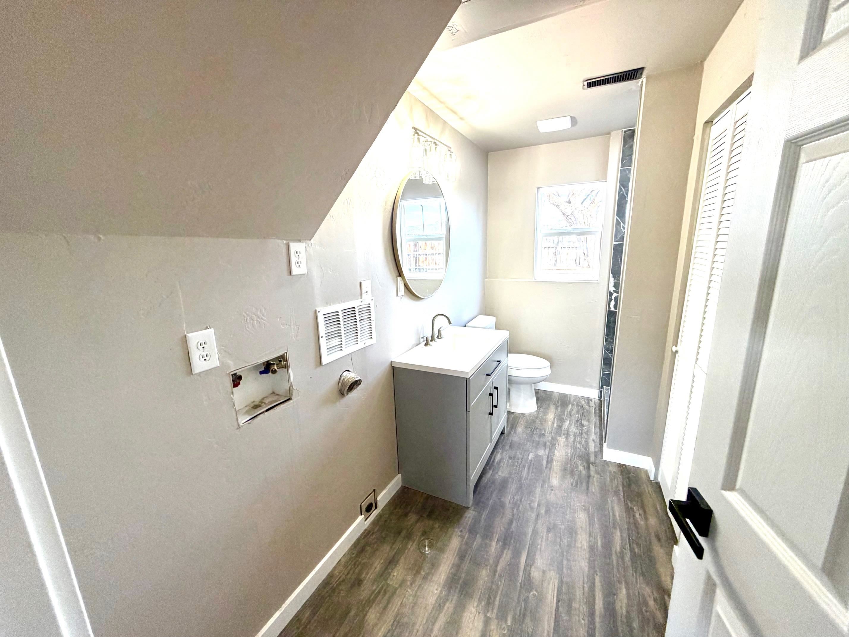 558 1/2 31 3/4 Road Grand Junction, CO 81504 - Photo 19 of 25 a bathroom with a sink mirror toilet and bathtub