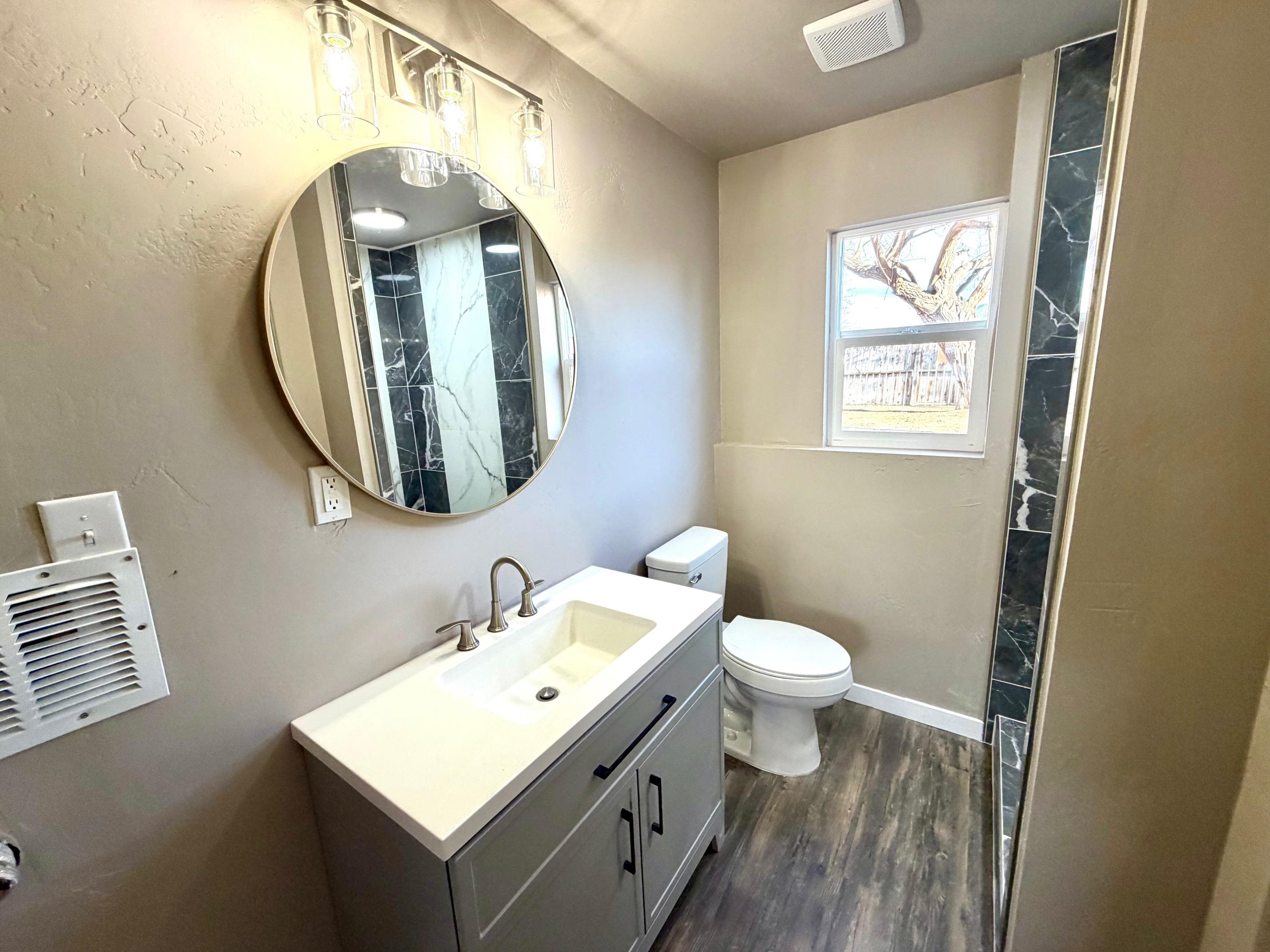 558 1/2 31 3/4 Road Grand Junction, CO 81504 - Photo 20 of 25 a bathroom with a toilet sink and mirror