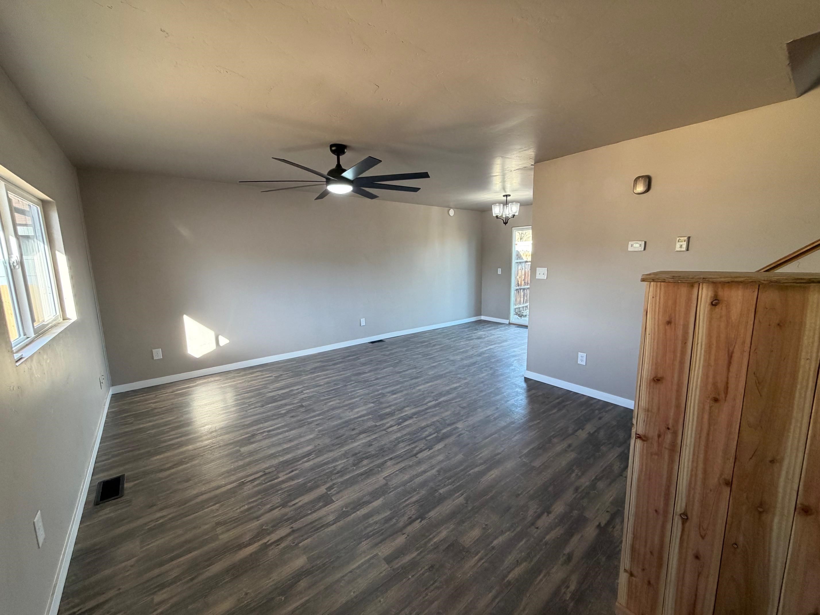 558 1/2 31 3/4 Road Grand Junction, CO 81504 - Photo 2 of 25 wooden floor in an empty room with a window