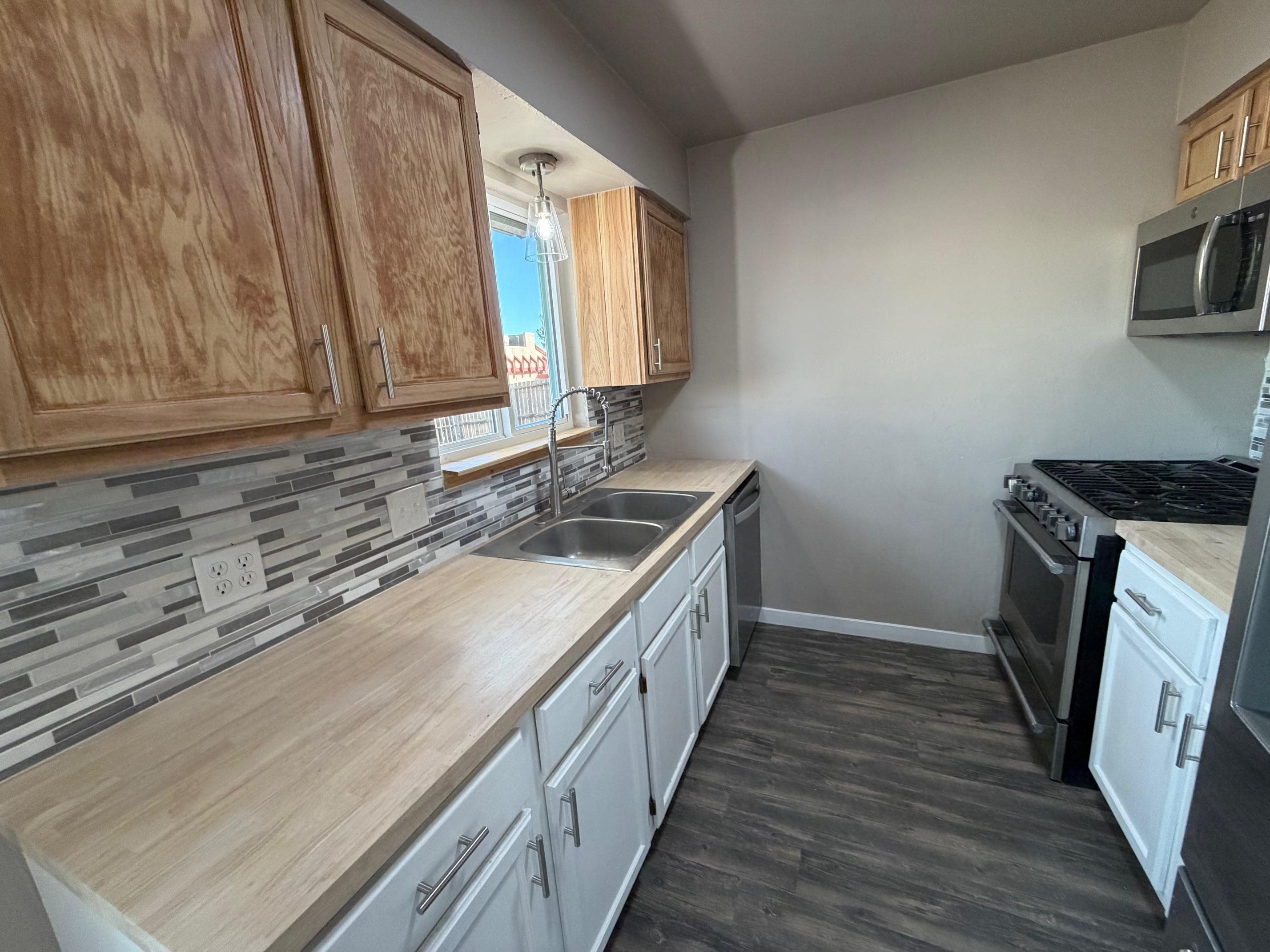 558 1/2 31 3/4 Road Grand Junction, CO 81504 - Photo 7 of 25 a kitchen with a sink stove and cabinets