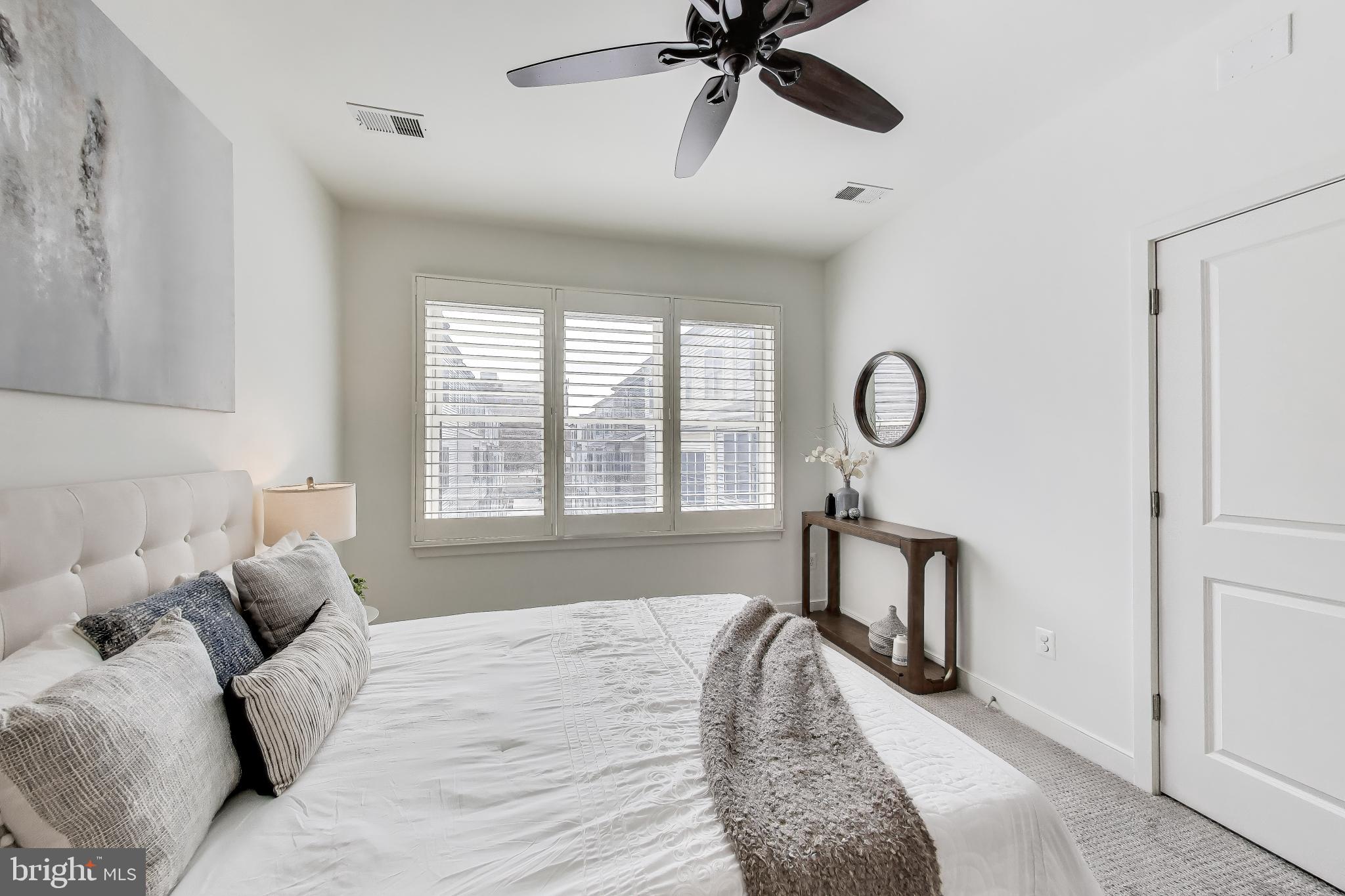 4405 Longfellow Street Hyattsville, MD 20781 - Photo 21 of 44 a bedroom with a bed mirror and window