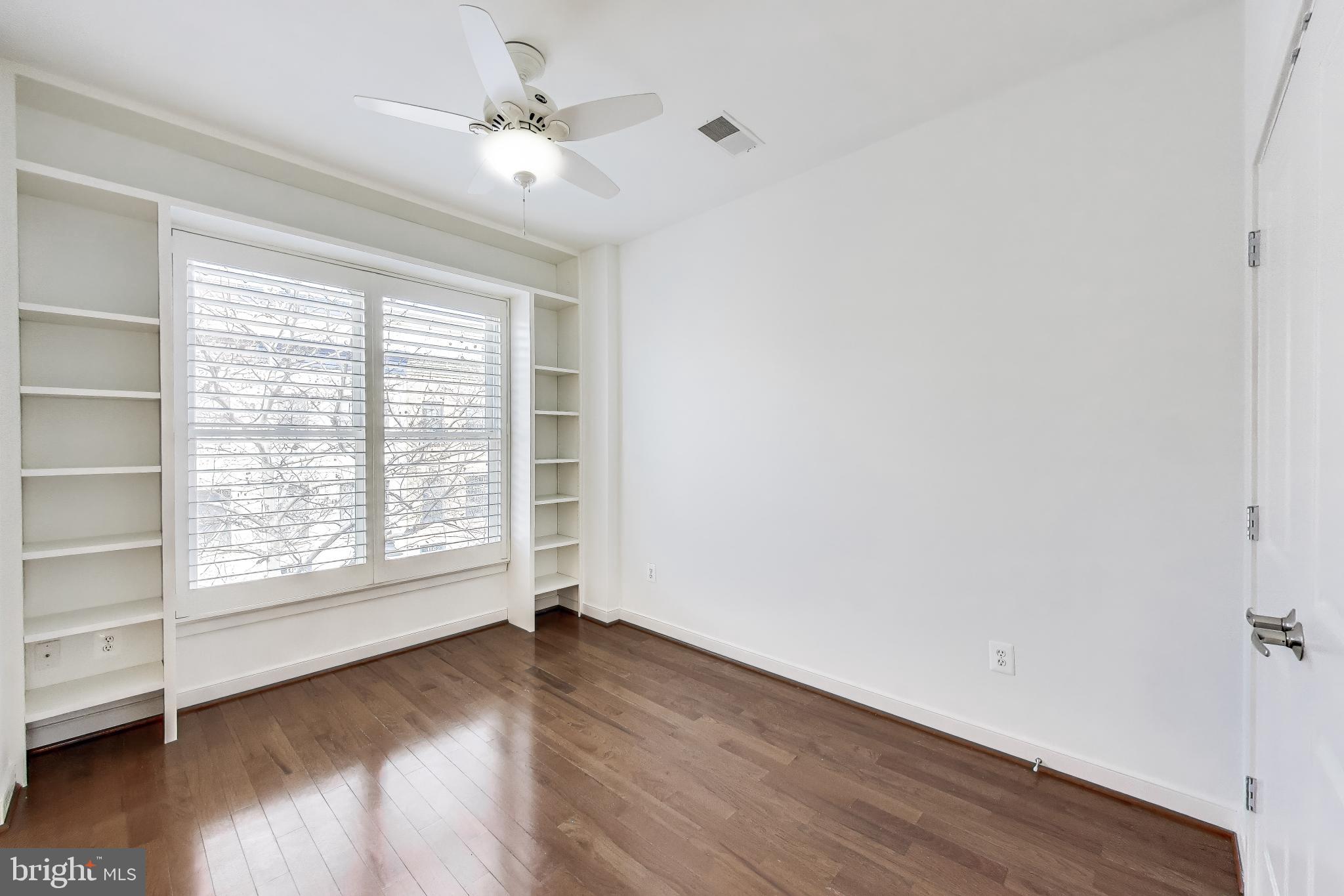 4405 Longfellow Street Hyattsville, MD 20781 - Photo 25 of 44 an empty room with wooden floor and windows
