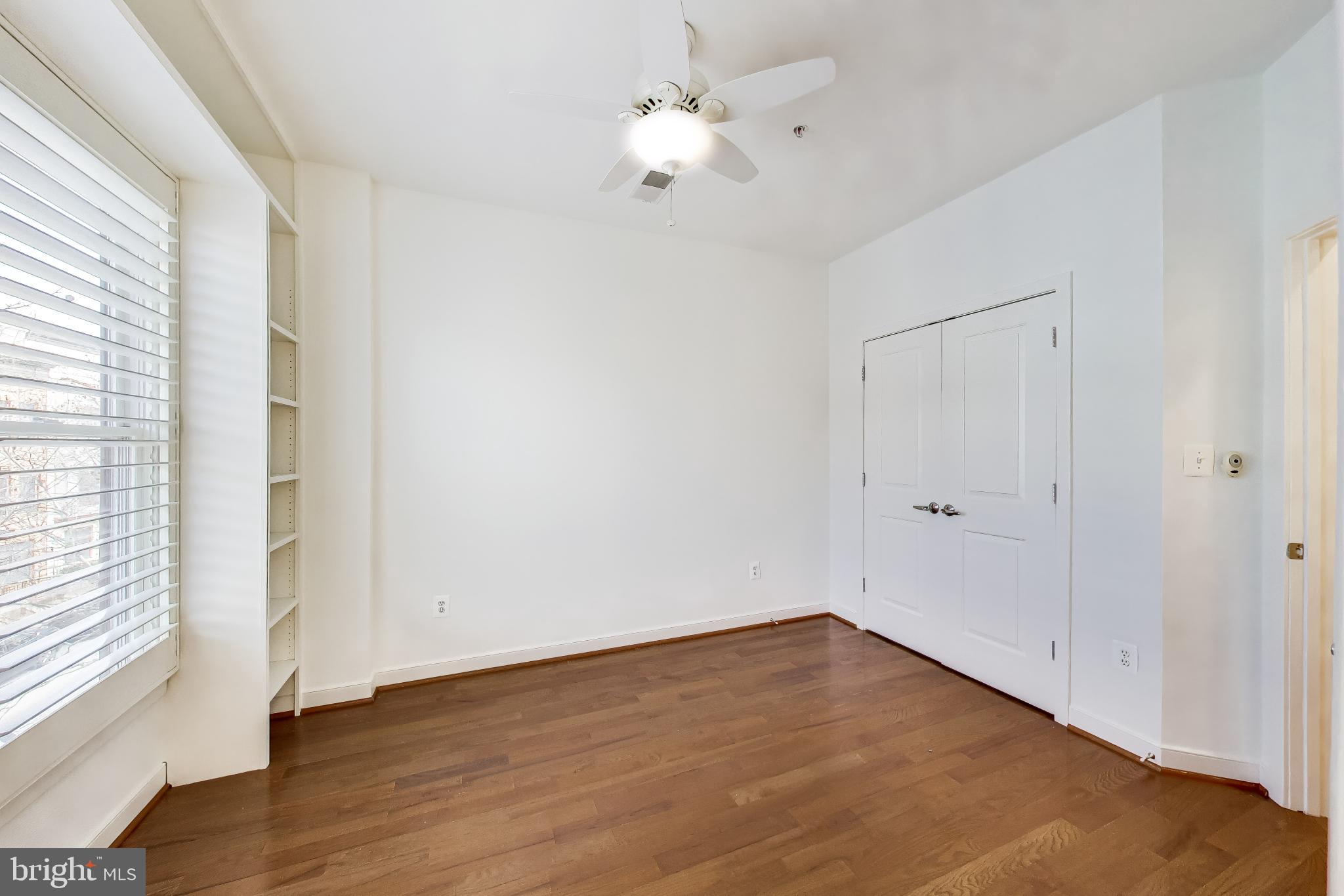 4405 Longfellow Street Hyattsville, MD 20781 - Photo 26 of 44 a view of an empty room with a window and wooden floor