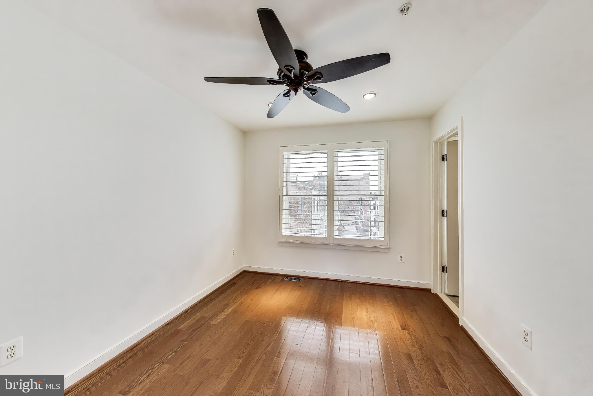 4405 Longfellow Street Hyattsville, MD 20781 - Photo 34 of 44 an empty room with wooden floor and windows