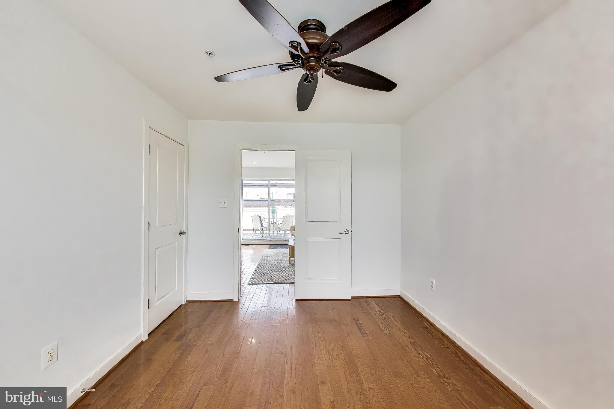 4405 Longfellow Street Hyattsville, MD 20781 - Photo 36 of 44 a view of empty room with wooden floor